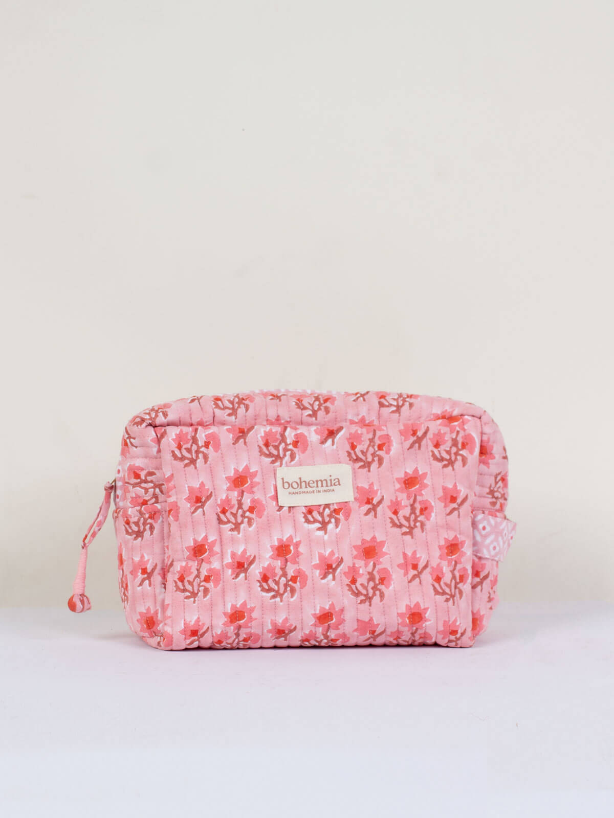 Medium hand block print, cotton quilted wash bag with a vintage pink floral design
